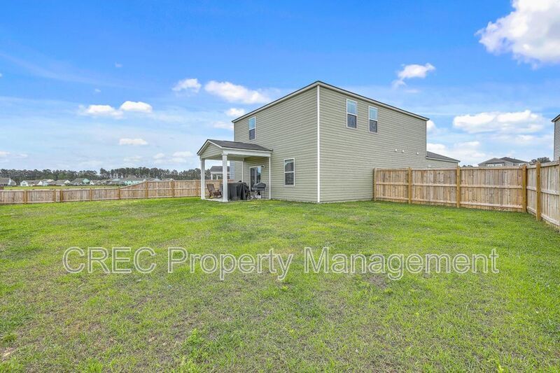 Like-New Pond Lot Home with First-Floor Primary Suite property image