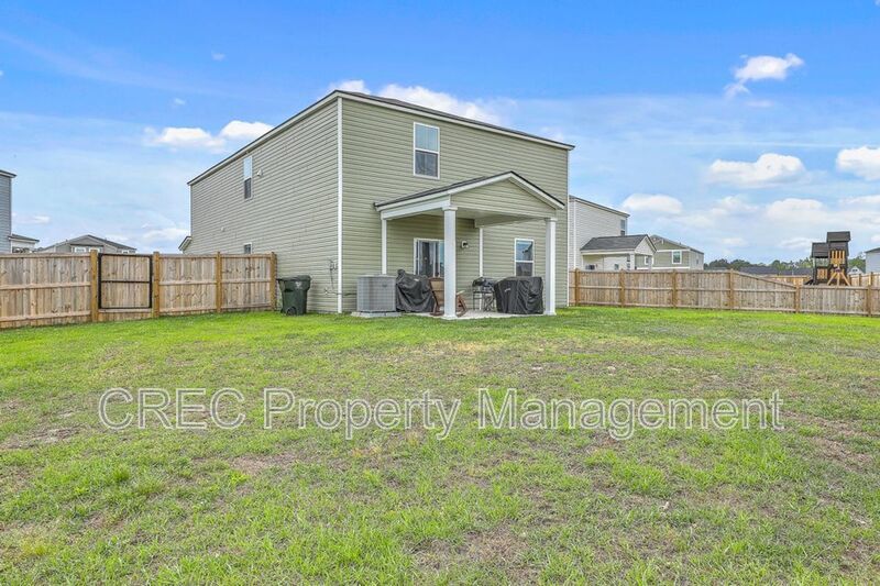 Like-New Pond Lot Home with First-Floor Primary Suite property image