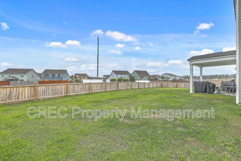 Like-New Pond Lot Home with First-Floor Primary Suite property image