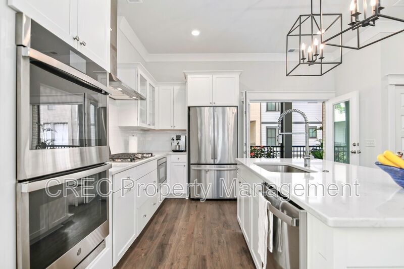 NEW PRICE & FREE MONTH OF RENT! Luxurious End-Unit Townhome with Elevator & Gourmet Kitchen – 4 Beds, 3.5 Baths, Prime Location! property image