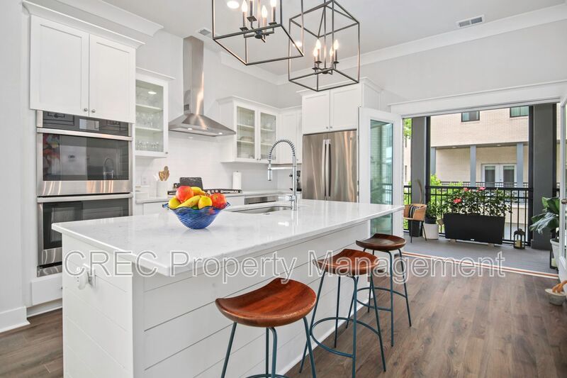 NEW PRICE & FREE MONTH OF RENT! Luxurious End-Unit Townhome with Elevator & Gourmet Kitchen – 4 Beds, 3.5 Baths, Prime Location! property image